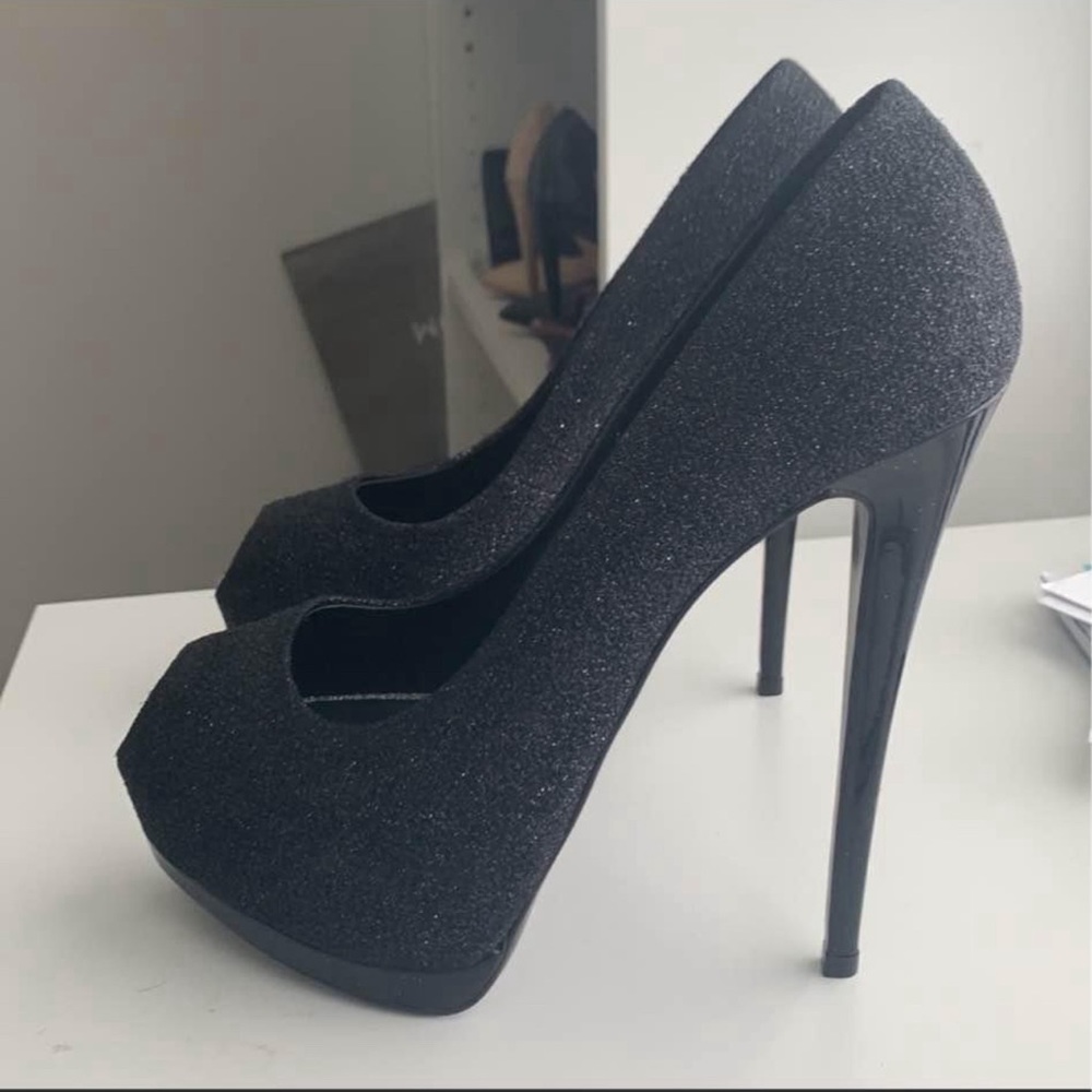 Giuseppe Zanotti black open toe pump.